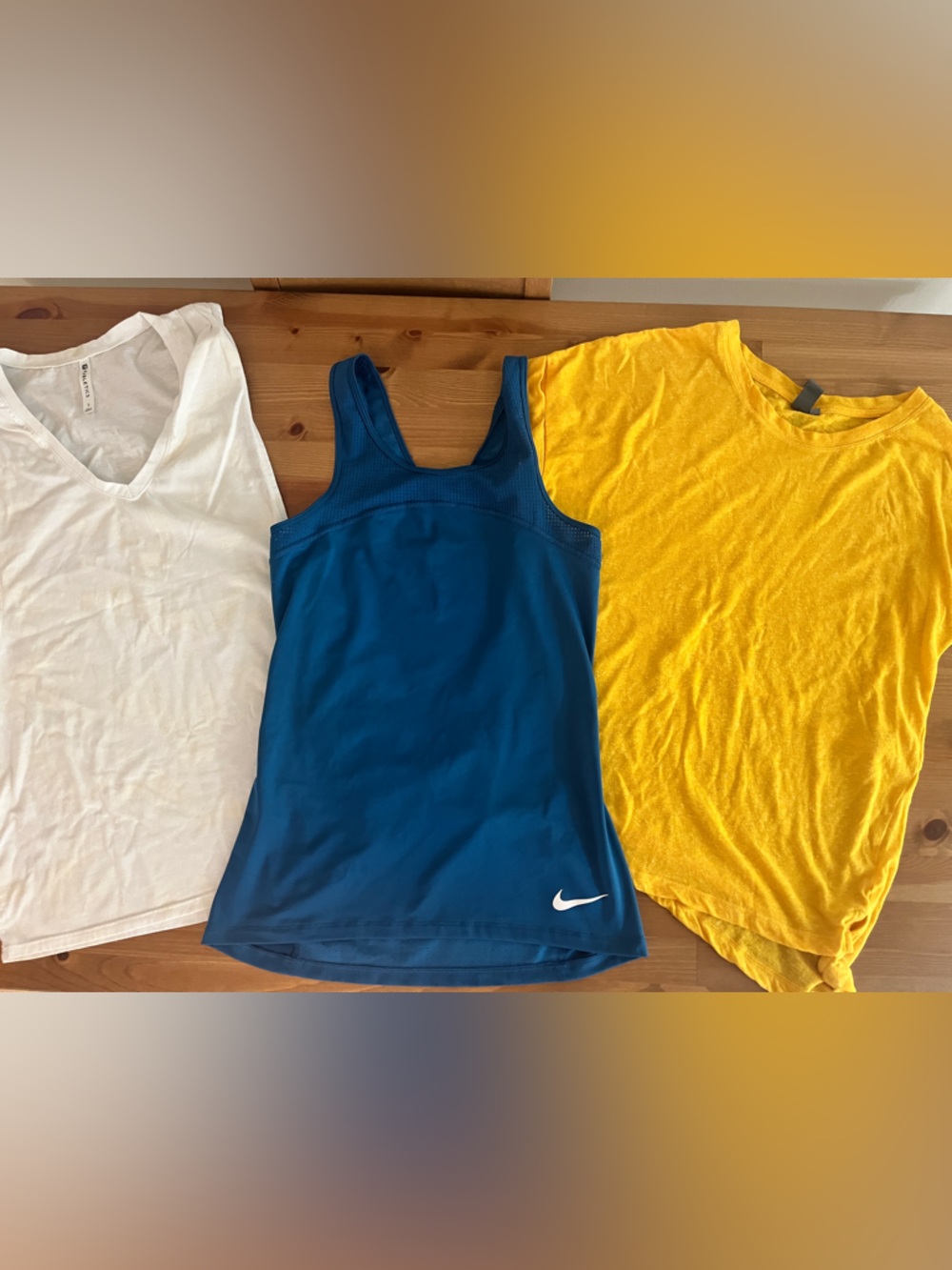 Set of three small workout tops…fabletics, Nike and sweaty Betty